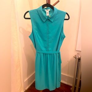 New with tags beautiful button up dress with belt beautiful blue color